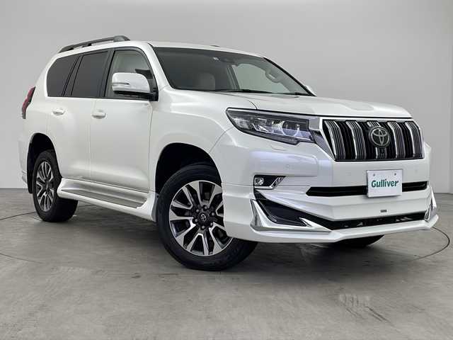 トヨタ ランドクルーザー プラド TX Lパッケージ 兵庫県 2022(令4)年 3.1万km ホワイトパールクリスタルシャイン モデリスタエアロ ムーンルーフ 衝突軽減ブレーキ レーンキープアシスト レーダークルーズコントロール メーカーオプションナビ フルセグ パノラマミックビューモニター ベージュ革 クリアランスソナー
