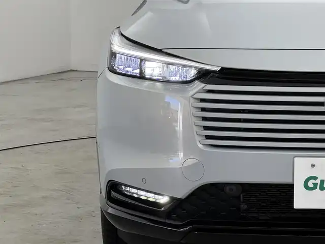 ホンダ ヴェゼル ハイブリッド e:HEV Z PLaYパッケージ 福岡県 2025(令7)年 0.1千km プレミアムサンライトホワイトパール 登録済未使用車　/純正９型ナビ　/バックカメラ　/置くだけ充電　/ＥＴＣ２．０　/衝突軽減　/レーンキープ　/ＢＳＷ　/アクセル踏み間違い防止　/パドルシフト　/ヒルディセントコントロール　/パワーバックドア　/純正１８インチＡＷ　/ＬＥＤ