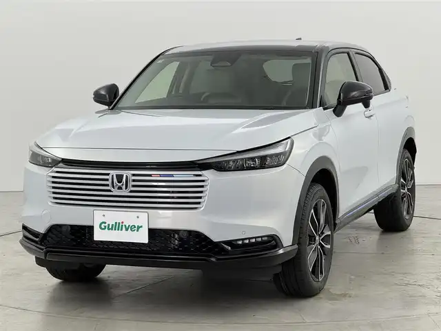 ホンダ ヴェゼル ハイブリッド e:HEV Z PLaYパッケージ 福岡県 2025(令7)年 0.1千km プレミアムサンライトホワイトパール 登録済未使用車　/純正９型ナビ　/バックカメラ　/置くだけ充電　/ＥＴＣ２．０　/衝突軽減　/レーンキープ　/ＢＳＷ　/アクセル踏み間違い防止　/パドルシフト　/ヒルディセントコントロール　/パワーバックドア　/純正１８インチＡＷ　/ＬＥＤ