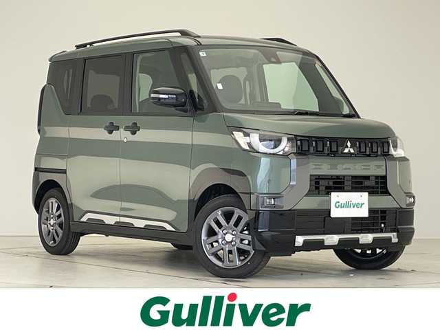 三菱 デリカミニ T プレミアム 愛知県 2025(令7)年 0.1千km 緑Ｍ 届出済未使用車/純正9型ディズプレイオーディオ　ナビ機能なし/マイパイロット/サイドデカール/全方位カメラ/両側パワースライドドア/シートヒーター/クルーズコントロール/コーナーセンサー/純正アルミホイール/ルーフレール/LEDヘッドライト/パドルシフト/インテリジェントミラー/オートマチックハイビーム/衝突軽減システム/Bluetooth/ステアリングスイッチ/スマートキー/プッシュスタート