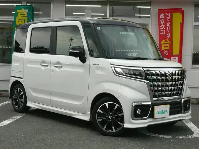 スズキ スペーシア カスタム HYBRID XS ターボ 静岡県 2022(令4)年 3.8万km ピュアホワイトパール/ブラック2トーン 禁煙車/両側パワースライドドア/ターボ車/全方位モニター用メモリーナビゲーション/（CD/DVD/BT/USB/フルセグTV）/セーフティサポート/・デュアルカメラブレーキサポート/・車線逸脱警報機能/・先行車発進お知らせ機能/・アダプティブクルーズコントロール/・後方誤発進抑制機能/・車線逸脱抑制機能/・誤発進抑制機能/ステアリングリモコン/パドルシフト/ブラックルーフ/ブラックドアミラー/ブラックリアスポイラー/ヘッドアップディスプレイ/リアサキュレーター/運転席シートヒーター/後席左右パーソナルテーブル/LEDヘッドライト/プッシュスタート・スマートキー/スペアキー/保証書・取扱説明書