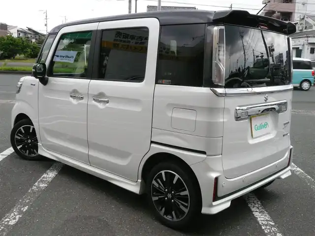スズキ スペーシア カスタム HYBRID XS ターボ 静岡県 2022(令4)年 3.8万km ピュアホワイトパール/ブラック2トーン 禁煙車/両側パワースライドドア/ターボ車/全方位モニター用メモリーナビゲーション/（CD/DVD/BT/USB/フルセグTV）/セーフティサポート/・デュアルカメラブレーキサポート/・車線逸脱警報機能/・先行車発進お知らせ機能/・アダプティブクルーズコントロール/・後方誤発進抑制機能/・車線逸脱抑制機能/・誤発進抑制機能/ステアリングリモコン/パドルシフト/ブラックルーフ/ブラックドアミラー/ブラックリアスポイラー/ヘッドアップディスプレイ/リアサキュレーター/運転席シートヒーター/後席左右パーソナルテーブル/LEDヘッドライト/プッシュスタート・スマートキー/スペアキー/保証書・取扱説明書