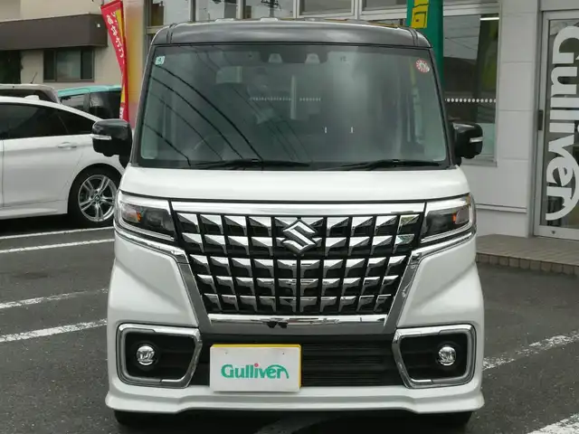 スズキ スペーシア カスタム HYBRID XS ターボ 静岡県 2022(令4)年 3.8万km ピュアホワイトパール/ブラック2トーン 禁煙車/両側パワースライドドア/ターボ車/全方位モニター用メモリーナビゲーション/（CD/DVD/BT/USB/フルセグTV）/セーフティサポート/・デュアルカメラブレーキサポート/・車線逸脱警報機能/・先行車発進お知らせ機能/・アダプティブクルーズコントロール/・後方誤発進抑制機能/・車線逸脱抑制機能/・誤発進抑制機能/ステアリングリモコン/パドルシフト/ブラックルーフ/ブラックドアミラー/ブラックリアスポイラー/ヘッドアップディスプレイ/リアサキュレーター/運転席シートヒーター/後席左右パーソナルテーブル/LEDヘッドライト/プッシュスタート・スマートキー/スペアキー/保証書・取扱説明書