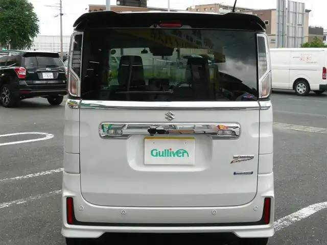 スズキ スペーシア カスタム HYBRID XS ターボ 静岡県 2022(令4)年 3.8万km ピュアホワイトパール/ブラック2トーン 禁煙車/両側パワースライドドア/ターボ車/全方位モニター用メモリーナビゲーション/（CD/DVD/BT/USB/フルセグTV）/セーフティサポート/・デュアルカメラブレーキサポート/・車線逸脱警報機能/・先行車発進お知らせ機能/・アダプティブクルーズコントロール/・後方誤発進抑制機能/・車線逸脱抑制機能/・誤発進抑制機能/ステアリングリモコン/パドルシフト/ブラックルーフ/ブラックドアミラー/ブラックリアスポイラー/ヘッドアップディスプレイ/リアサキュレーター/運転席シートヒーター/後席左右パーソナルテーブル/LEDヘッドライト/プッシュスタート・スマートキー/スペアキー/保証書・取扱説明書