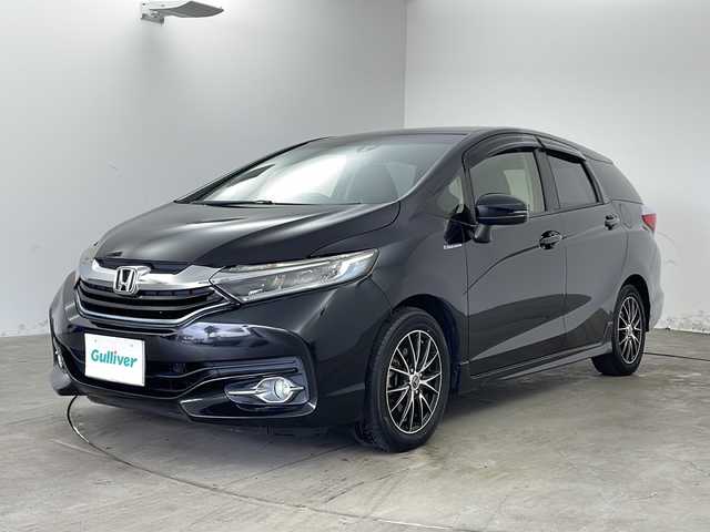 ホンダ シャトル ハイブリッド X 兵庫県 2017(平29)年 7.5万km クリスタルブラックパール ・純正ナビ/TV/SD/BT/CD/DVD/・バックカメラ/・ビルトインETC/・シティブレーキアクティブシステム/・横滑り防止/・オートワイパー/・パドルシフト/・クルーズコントロール/・ステアリングリモコン/・LEDオートライト/・フォグランプ/・ウインカーミラー/・ハーフレザー/・革巻きステアリング/・シートリフター/・チップアップシート/・社外15インチアルミホイール/・社外15インチアルミホイール付き冬タイヤ車載/・純正フロアマット/・ドアバイザー/・電動格納ミラー/・スマートキー/・プッシュスタート/・W＋サイドエアバック/・カーテンエアバック/・ECON