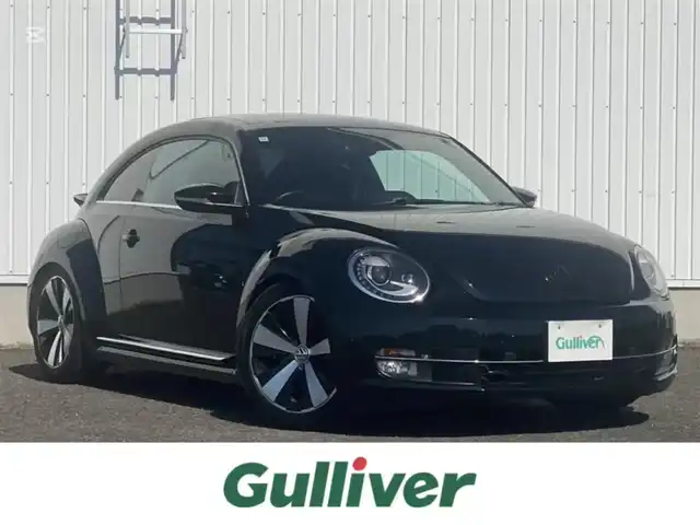 フォルクスワーゲン ザ・ビートル ターボ 熊本県 2014(平26)年 6万km 黒 純正ナビ/FM/AM/CD/DVD/SD/BT/VTR/MusicCatcher/・DTV/・バックカメラ/パッシブセーフティ/・フロントエアバック/・サイドエアバック/・むちうち軽減ヘッドレスト/クルーズコントロール/コーナーセンサー/サンルーフ/ドライブレコーダー（前方）/革巻きステアリング/ステアリングスイッチ/ウィンカーミラー/電動格納ミラー/ミラーヒーター/パーキングライト/オートライト/レーダー検知（社外）/社外車高調/純正フロアマット/純正ドアバイザー/純正アルミホイール