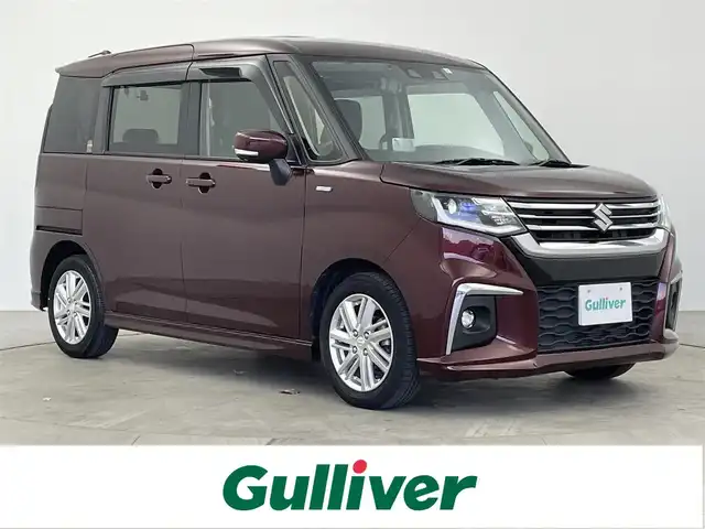 スズキ ソリオ HV MZ 大分県 2023(令5)年 5.6万km メロウディープレッドパール スズキセーフティーサポート/・デュアルセンサーブレーキサポート/・標識認識機能/・発進お知らせ機能/・アダプティブクルーズコントロール/・車線維持支援機能/・ハイビームアシスト/社外ナビ/（フルセグ/Bluetooth/CD/DVD)/ヘッドアップディスプレイ/ETC/前席シートヒーター/ステアリングスイッチ/両側パワースライドドア/オートライト/LEDヘッドライト/社外デジタルインナーミラー/電動格納ミラー/純正アルミホイール
