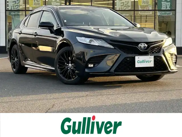 トヨタ カムリ WS ブラックエディション 岡山県 2021(令3)年 6.5万km プレシャスブラックパール 登録時走行距離65032km/純正ナビ/(AM.FM.BT)/バックカメラ/ETC2.0/ブラインドスポットモニター/シートヒーター/クリアランスソナー/衝突軽減ブレーキ/横滑り防止装置/クルーズコントロール(追従走行あり)/車線逸脱警報（レーンキープアシスト）/オートライト/オートマチックハイビーム/アイドリングストップ/電動リアゲート/18インチ純正AW/純正フロアマット/ハーフレザーシート/D+N席パワーシート
