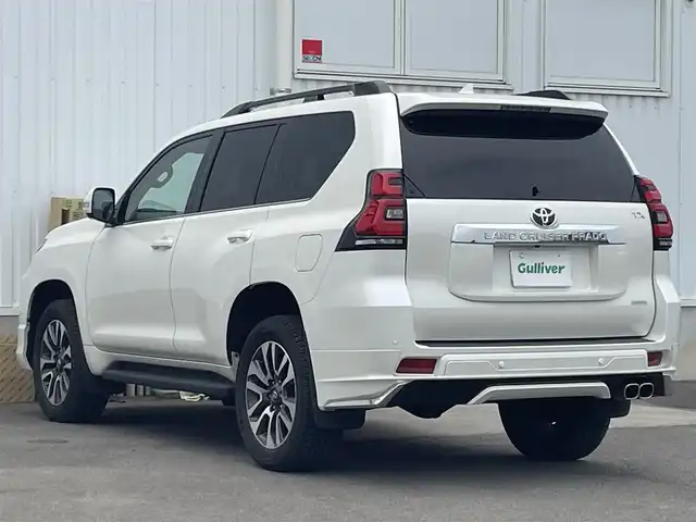 トヨタ ランドクルーザー プラド TX Lパッケージ 愛媛県 2023(令5)年 1.2万km ホワイトパールクリスタルシャイン ワンオーナー/トヨタセーフティー/純正ディスプレイオーディオ/（Bluetooth/AppleCarPlay/AndroidAuto)/アランドビューモニター/ビルドインETC2.0/サンルーフ/モデリスタエアロ/レザーシート/パワーシート/エアシート/シートヒーター/ルーフレール/アダプティブクルーズコントロール/プリクラッシュセーフティー/ブラインドスポットモニター/純正19インチアルミホイール/LEDヘッドライト/オートマチックハイビーム/ダウンヒルアシストコントロール/センターデフロック/スペアキー1本/取扱説明書/保証書