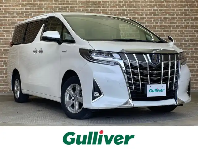 トヨタ アルファードハイブリット X 岩手県 2020(令2)年 8.1万km ホワイトパールクリスタルシャイン ワンオーナー/４WD/両側パワースライドドア/トヨタセーフティセンス/プリクラッシュセーフティ/レーダークルーズコントロール/レーンアシスト/ロードサインアシスト/先行車発進告知機能/コーナーセンサー/横滑り防止装置/オートブレーキホールド/後席用オートエアコン/オットマン/AC100V1500Wアクセサリーコンセント/純正ナビ/（フルセグ/USB/Bluetooth/AppleCarPlay/AndroidAuto）/バックカメラ/ETC2.0/ドライブレコーダー/ステアリングスイッチ/LEDヘッドランプ/純正16インチアルミホイール