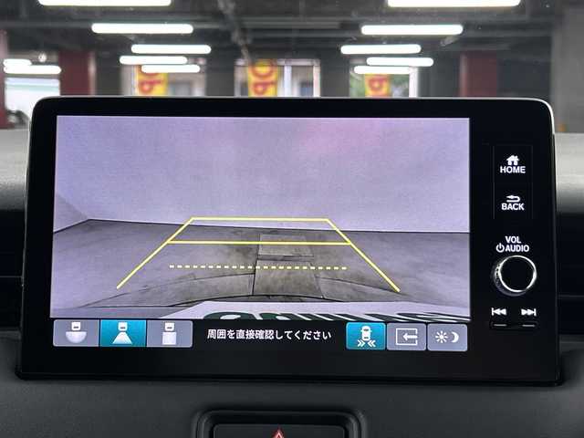 ホンダ ヴェゼル ハイブリッド e:HEV Z 愛知県 2024(令6)年 0.5万km プレミアムサンライトホワイトパール 禁煙車/純正9インチナビ/（AM/FM/Bluetooth/フルセグTV）/バックカメラ/ワイヤレス充電/ホンダセンシング/・衝突軽減ブレーキ/・誤発進抑制機能/・レーンキープアシスト/・オートマチックハイビーム/・追従式クルーズコントロール/コーナーセンサー/ETC2.0/ドライブレコーダー/シートヒーター/ステアリングヒーター/電動リアゲート/パドルシフト/ダウンヒルアシスト/LEDヘッドライト/スマートキー/純正アルミホイール