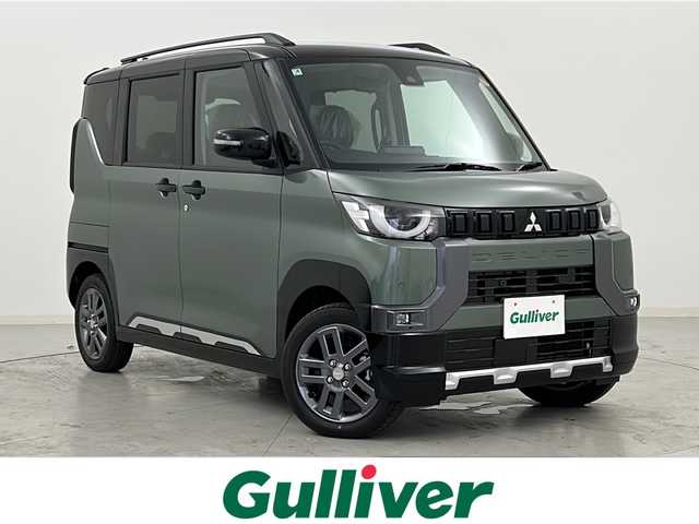 三菱 デリカミニ T プレミアム 宮城県 2025(令7)年 0.1千km ＤグリーンＭ 届出済未使用車/アラウンドビューモニター/ハーフレザーシート/両側パワースライドドア/マイパイロット/衝突軽減ブレーキ/レーンディパーチャーウォーニング/オートハイビーム/コーナーセンサー/純正9型ディスプレイオーディオ/・USB・BT・スマホ連動/デジタルインナーミラー/ステアリングヒーター/パドルシフト/ステアリングスイッチ/電動パーキングブレーキ/オートホールド/LEDヘッドライト/LEDフォグライト/スマートキー×2/純正15インチアルミホイール/ロールサンシェード/シートバックテーブル