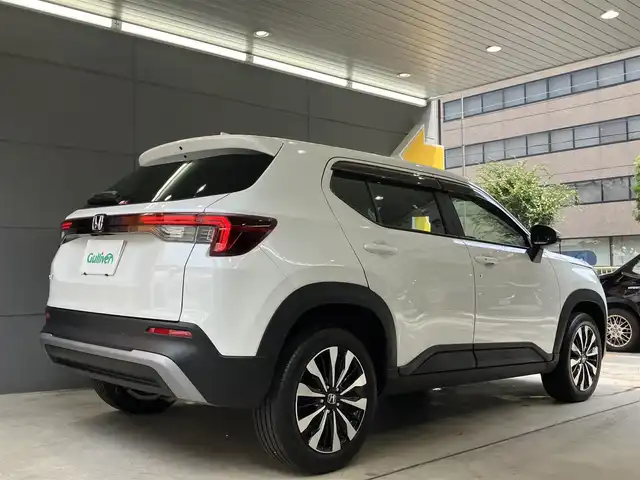 ホンダ ＷＲ－Ｖ Z 東京都 2025(令7)年 0.7万km プラチナホワイトパール ホンダセンシング/●衝突軽減ブレーキ（CMBS）/●先行車発進お知らせ機能/●歩行者事故低減ステアリング/●路外逸脱抑制機能●標識認識機能/●アダプティブクルーズコントロール（ACC）/●車線維持支援システム（LKAS）/●誤発進抑制機能/●後方誤発進抑制機能/●近距離衝突軽減ブレーキ/●急アクセル抑制機能/●パーキングセンサーシステム/●オートハイビーム/純正8インチナビ/バックカメラ/Bluetooth/フルセグテレビ/パドルシフト/スマートキー/コーナーセンサー /ビルトインETC/LEDヘッドライト　フォグランプ/USB端子/ドライブレコーダー前後/ステリングリモコン/ウィンカーミラー/保証書・取扱説明書・スペアキー