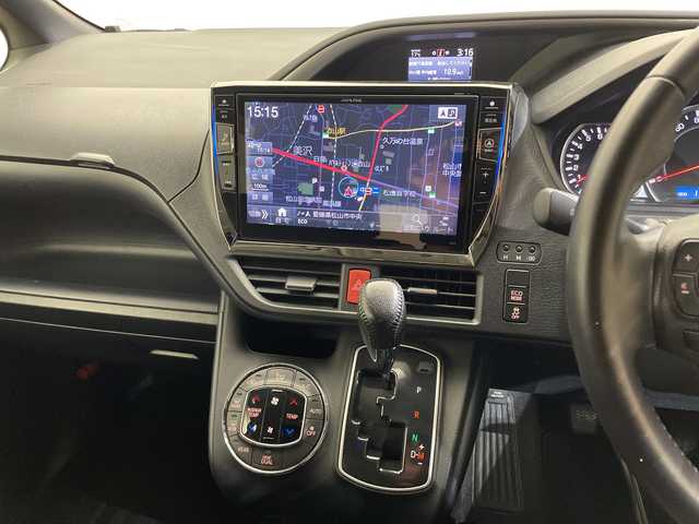 トヨタ ヴォクシー ZS 煌 愛媛県 2015(平27)年 11.4万km ブラック ALPINE10型ナビ/フルセグ　Bluetooth DVD再生可/ALPINE後席フリップダウンモニター/クルーズコントロール//ワンタッチスイッチ付パワースライドドア（両側）/LEDフロントフォグランプ/LEDクリアランスランプ（メッキエクステンション）/LEDルームランプ（フロントパーソナル・センター・リヤ）/フードモール（中央：メッキ、上:ブラック、下：メッキ）/レザー調シートカバー/Toyota Safety Sense C/（・プリクラッシュセーフティシステム/ （レーザーレーダー＋単眼カメラ方式）/・レーンディパーチャーアラート/・オートマチックハイビーム）/専用エアロパーツ（フロント大型バンパー［メッキ加飾付］/＋フロントフェンダー＋リヤ大型バンパー＋リヤスポイラー＋大型サイドマッドガード