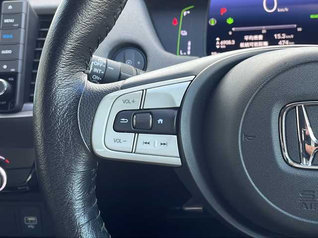ホンダ フィット e:HEVネス 山口県 2020(令2)年 1.7万km ミッドナイトブルービームM 純正９インチSDナビ/　AM/FM/SD/Bluetooth/フルセグテレビ/ビルトインETC/前後ドライブレコーダー/バックカメラ/プッシュスタート/アイドリングストップ/電動パーキングブレーキ/オートマチックハイビーム/純正LEDヘッドライト/純正16インチアルミホイール/コーナーセンサー/ホンダセンシング/　衝突軽減ブレーキ/　先行者発進お知らせ機能/　路外逸脱抑制機能/　追従機能付きアダプティブクルーズコントロール/　車線維持支援システム/USB端子/ドアバイザー/純正フロアマット/電動格納ウィンカーミラー/　