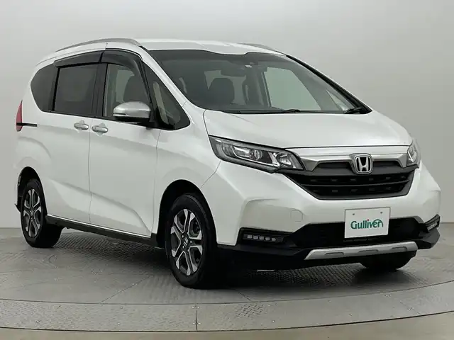 ホンダ フリード クロスター 新潟県 2022(令4)年 3.5万km プラチナホワイトパール ４WD/ホンダセンシング/寒冷地仕様/社外SDナビ　/　　CD/DVD/AM/FM/SD/フルセグ/Bluetooth/バックモニター/両側パワースライドドア/アダプティブクルーズコントロール/LEDオートライト/前席シートヒーター/ハーフレザーシート/純正15インチアルミホイール付/前後ドライブレコーダー/リアサンシェード/アイドリングストップ/純正フロアマット/ドアバイザー/スペアキー/スマートキー