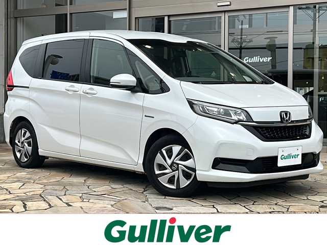 ホンダ フリード ハイブリット G ホンダセンシング 静岡県 2020(令2)年 5.9万km プラチナホワイトパール 社外ナビ/・Bluetooth/・CD/DVD/・ワンセグTV/・USB/・SD/主要装備/・プッシュスタート/・両側パワースライドドア/・ETC車載器/・前席シートヒーター/・コーナーセンサー/・純正フロアマット/・オートライト/・LEDヘッドライト/・後席サンシェード/ホンダセンシング/・衝突軽減ブレーキ/・車線維持支援システム/・アダプティブクルーズコントロール/・誤発進抑制機能/・歩行者事故低減ステアリング/・路外逸脱抑制機能/・先行車発進お知らせ機能/・標識認識機能