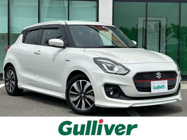 スズキ スイフト HYBRID RS 和歌山県 2018(平30)年 2.4万km ピュアホワイトP 社外ナビ/Bluetooth/フルセグTV/バックカメラ/プリクラッシュセーフティ/レーンキープアシスト/横滑り防止装置/レーダークルーズコントロール/本革ステアリング/LEDヘッドライト/オートライト/フォグランプ/前後ドライブレコーダー/純正16インチアルミホイール/ビルトインETC/シートヒーター（ドライブ席）/パドルシフト/アイドリングストップ/ステリングリモコン/ドアバイザー/純正フロアマット/ウィンカーミラー/プッシュスタート/スマートキー