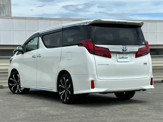 トヨタ アルファードハイブリット S タイプゴールドⅡ 静岡県 2021(令3)年 5.8万km パール ４ＷＤ/トヨタセーフティセンス/純正９型ディスプレイ/ナビＴＶキット/フルセグTV/バックカメラ/ビルトインＥＴＣ/ドラレコ/オットマン/100V/1500W/両側電動スライドドア/電動リアゲート/レーダークルーズ/ハーフレザー/WAC/３眼ＬＥＤヘッド/オートライト/オートハイビーム/モデリスタ製２０ＡＷ