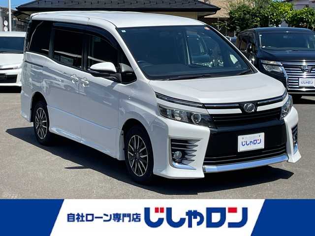 トヨタ ヴォクシー ZS 宮城県 2014(平26)年 13.9万km ホワイトパールクリスタルシャイン (株)IDOMが運営する【じしゃロン仙台店】の自社ローン専用車両になりますこちらは現金またはオートローンご利用時の価格です。自社ローンご希望の方は別途その旨お申付け下さい/両側パワスラ/フリップダウンモニター/10インチSDナビ/フルセグ/Bluetooth/バックカメラ/CD/DVD/ドラレコ/ビルトインETC/LEDヘッドライト