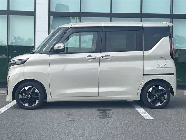 日産 ルークス HWS X プロパイロットED 和歌山県 2022(令4)年 1.7万km フローズンバニラパール 純正9インチナビ（MM321D-V）/フルセグTV/Bluetooth/CD/DVD/USB/全周囲カメラ/ビルトインETC/前後ドライブレコーダー/プロパイロット/衝突軽減カメラ/レーンキープアシスト/レーダークルーズコントロール/コーナーセンサー/両側パワースライドドア/ハンズフリーオートスライド/快適パックA/プラズマクラスター付きリヤシーリングファン/パーソナルテーブル/カップホルダー9個/助手席裏USBソケット/ロールサンシェード/撥水加工シート/電動パーキングブレーキ/オートブレーキホールド/LEDヘッドライト/フォグランプ/オートライト/オートハイビーム/純正14インチAW/ドアバイザー/プッシュスタート/スマートキー