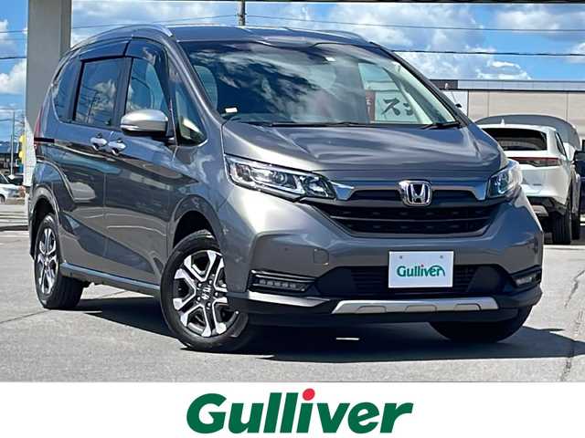 ホンダ フリード クロスター ホンダセンシング 道北・旭川 2020(令2)年 1.7万km スーパープラチナグレーメタリック /４ＷＤ//禁煙車//純正ナビ//ＣＤ/ＤＶＤ/フルセグ/ＢＴ//両側パワースライドドア//前席シートヒーター//ホンダセンシング/アダプティブ・クルーズ・コントロール/衝突軽減ブレーキ/誤発進抑制機能/歩行者事故低減ステアリング/路外逸脱抑制機能/車線維持支援システム/先行車発信お知らせ機能/標識認識機能//バックカメラ//ＬＥＤヘッドライト//オートライト//アダクティブコーナーリングランプ//ハーフレザーシート//ステアリングリモコン//フロントワイパーデアイサー//ドアミラーヒーター//保証書、取説//スペアキー×１