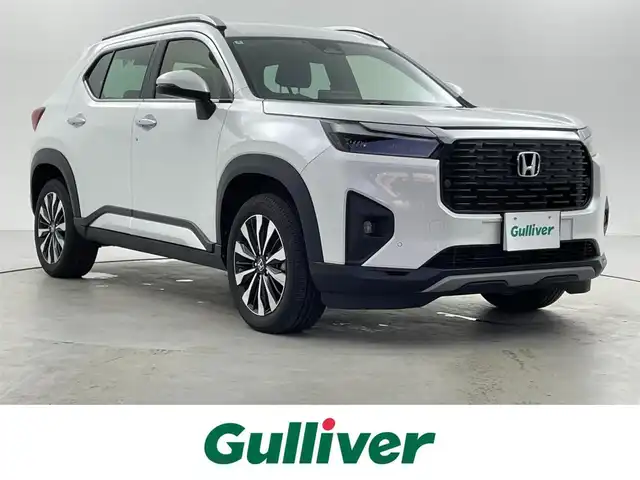 ホンダ ＷＲ－Ｖ Z+ 福井県 2024(令6)年 0.8万km プラチナホワイトパール 純正8型ナビ/(FM/AM/フルセグTV/Bluetooth）/バックカメラ/Honda SENSING/-CMBS　衝突軽減ブレーキ/-ACC　アダプティブクルーズ/-LKAS　車線維持支援システム/-前後パーキングセンサーシステム/-路外逸脱抑制機能/-標識認識機能/-オートハイビーム機能/-先行車発進お知らせ機能/ルーフレール/ハーフレザーシート/オートエアコン/オートライト/LED ヘッドライト＋フロントフォグライト/パドルシフト