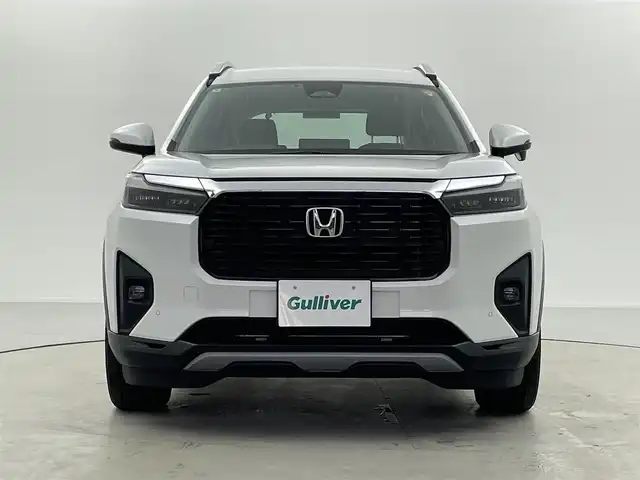 ホンダ ＷＲ－Ｖ Z+ 福井県 2024(令6)年 0.8万km プラチナホワイトパール 純正8型ナビ/(FM/AM/フルセグTV/Bluetooth）/バックカメラ/Honda SENSING/-CMBS　衝突軽減ブレーキ/-ACC　アダプティブクルーズ/-LKAS　車線維持支援システム/-前後パーキングセンサーシステム/-路外逸脱抑制機能/-標識認識機能/-オートハイビーム機能/-先行車発進お知らせ機能/ルーフレール/ハーフレザーシート/オートエアコン/オートライト/LED ヘッドライト＋フロントフォグライト/パドルシフト