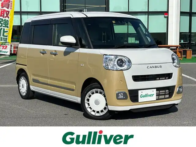 ダイハツ ムーヴ キャンバス ストライプス G 奈良県 2022(令4)年 2.3万km シャイニングホワイトパール/サンドベージュメタリック 純正ナビ（NMZN-W727)/（フルセグ/BT/CD/DVD)/アラウンドビューモニター/前後コーナーセンサー/衝突軽減システム/レーンキープアシスト/両側パワースライドドア/前席シートヒーター/LEDヘッドライト/前方ドライブレコーダー/ETC/純正ホイールキャップ/保証書/取り扱い説明書/スペアキーX1