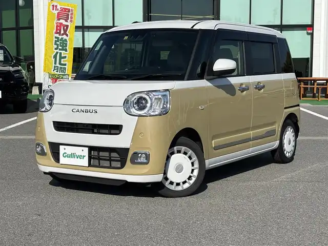 ダイハツ ムーヴ キャンバス ストライプス G 奈良県 2022(令4)年 2.3万km シャイニングホワイトパール/サンドベージュメタリック 純正ナビ（NMZN-W727)/（フルセグ/BT/CD/DVD)/アラウンドビューモニター/前後コーナーセンサー/衝突軽減システム/レーンキープアシスト/両側パワースライドドア/前席シートヒーター/LEDヘッドライト/前方ドライブレコーダー/ETC/純正ホイールキャップ/保証書/取り扱い説明書/スペアキーX1