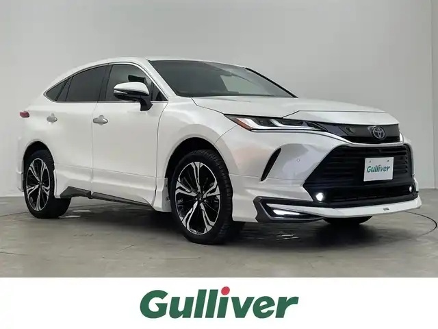 トヨタ ハリアー ハイブリッド Z レザーパッケージ 埼玉県 2020(令2)年 2.2万km ホワイトパールクリスタルシャイン モデリスタエアロ/モデリスタ２０インチアルミホイール/JBLサウンド/トヨタセーフティーセンス/プリクラッシュセーフティ/レーンディパーチャーアラート/レーダークルーズコントロール/ロードサイドアシスト/オートマチックハイビーム/ブラインドスポットモニター/インテリジェントクリアランスソナー/純正ディスプレイオーディオ12.3インチ/地デジTV Bluetooth USB/ヘットアップディスプレイ/デジタルインナーミラー/パノラミックビューモニター/レザーシート/シートヒーター/ベンチレーション/前席パワーシート/ステアリングヒーター/運転席シートメモリー/パワーバックドア/社外ドライブレコーダー前後/ビルトインETC2.0/LEDオートライト