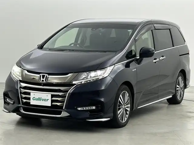 ホンダ オデッセイ ハイブリッド アブソルート・EXホンダセンジング 福岡県 2019(平31)年 4.3万km プレミアムヴィーナスブラックP 後席モニター　/純正９型ナビ（ＢＴ，フルセグＴＶ）　/全方位カメラ　/ＥＴＣ　/前後ドラレコ　/ＡＣＣ　/コーナーセンサー　/衝突軽減ブレーキ　/レーンキープ　/パーキングアシスト　/両側電動スライドドア　/ハーフレザー