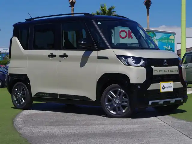 三菱 デリカミニ T プレミアム 千葉県 2025(令7)年 0.1千km アイボリーⅡ T　PREMIUM　9型ディスプレイオーディオ（121/330）CHAMONIXパッケージ（179190）/e-Assist/・衝突被害軽減ブレーキシステム（FCM）/・誤発進抑制機能（前進＆後退時）（UMS）/・車線逸脱警報システム（LDW）/・レーダークルーズコントロールシステム（ACC）/・オートマチックハイビーム[AHB]/マイパイロット/ハンズフリー両側パワースライドドア/ディスプレイオーディオ/【Bluetooth接続】/【Apple CarPlay　Android Auto対応】/マルチアラウンドモニター/デジタルインナーミラー/ハーフレザーシート/前席シートヒーター/ステアリングスイッチ/ステアリングヒーター/革巻きステアリング/パドルシフト/LEDヘッドライト/フォグライト/ウインカーミラー/コーナーセンサー/純正15インチアルミホイル/サイド/カーテンエアバッグ/キーレスオペレーションシステム