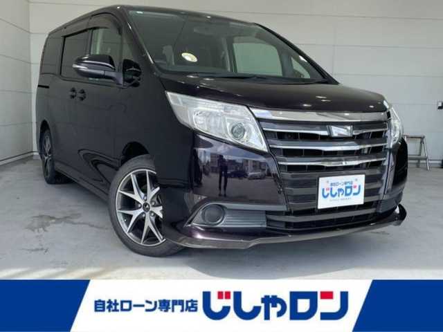 トヨタ ノア X 沖縄県 2014(平26)年 7.8万km ボルドーマイカメタリック (株)IDOMが運営する【じしゃロンコザ店】の自社ローン専用車両になりますこちらは現金またはオートローンご利用時の価格です。自社ローンご希望の方は別途その旨お申付け下さい/本土仕入れ　/純正ナビ　/フルセグＴＶ　/Ｂｌｕｅｔｏｏｔｈ接続　/ＥＴＣ　/両側パワースライドドア　/アイドリングストップ　/オートライト　/純正フロアマット　/モデリスタアルミホイール