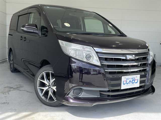 トヨタ ノア X 沖縄県 2014(平26)年 7.8万km ボルドーマイカメタリック (株)IDOMが運営する【じしゃロンコザ店】の自社ローン専用車両になりますこちらは現金またはオートローンご利用時の価格です。自社ローンご希望の方は別途その旨お申付け下さい/本土仕入れ　/純正ナビ　/フルセグＴＶ　/Ｂｌｕｅｔｏｏｔｈ接続　/ＥＴＣ　/両側パワースライドドア　/アイドリングストップ　/オートライト　/純正フロアマット　/モデリスタアルミホイール