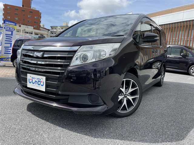 トヨタ ノア X 沖縄県 2014(平26)年 7.8万km ボルドーマイカメタリック (株)IDOMが運営する【じしゃロンコザ店】の自社ローン専用車両になりますこちらは現金またはオートローンご利用時の価格です。自社ローンご希望の方は別途その旨お申付け下さい/本土仕入れ　/純正ナビ　/フルセグＴＶ　/Ｂｌｕｅｔｏｏｔｈ接続　/ＥＴＣ　/両側パワースライドドア　/アイドリングストップ　/オートライト　/純正フロアマット　/モデリスタアルミホイール