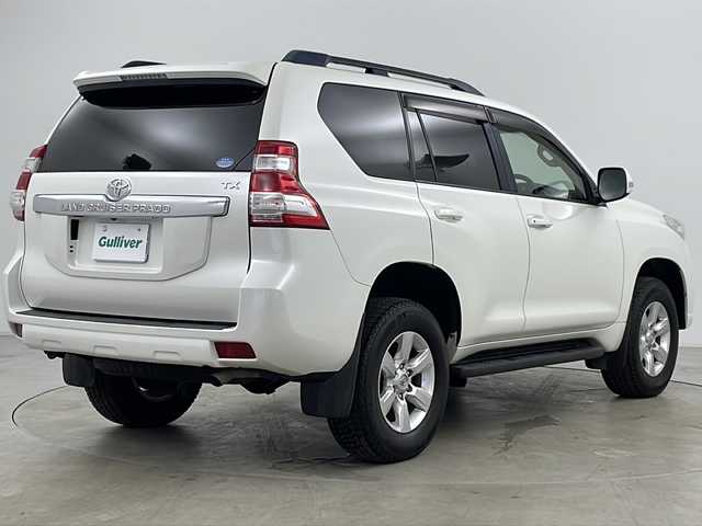 トヨタ ランドクルーザー プラド TX Lパッケージ 道央・札幌 2015(平27)年 8万km ホワイトパールクリスタルシャイン ・4WD/・社外ナビ(TV＆BT＆DVD＆CD)/・社外後席フリップダウンモニター/・バックカメラ/・レザーシート/・パワーシート/・シートヒーター/・クルーズコントロール/・横滑り防止/・純正ビルトインETC/・ドアミラーウィンカー/・オートライト/・フォグランプ
