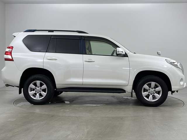 トヨタ ランドクルーザー プラド TX Lパッケージ 道央・札幌 2015(平27)年 8万km ホワイトパールクリスタルシャイン ・4WD/・社外ナビ(TV＆BT＆DVD＆CD)/・社外後席フリップダウンモニター/・バックカメラ/・レザーシート/・パワーシート/・シートヒーター/・クルーズコントロール/・横滑り防止/・純正ビルトインETC/・ドアミラーウィンカー/・オートライト/・フォグランプ