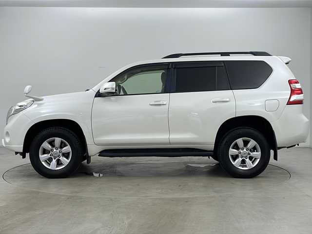 トヨタ ランドクルーザー プラド TX Lパッケージ 道央・札幌 2015(平27)年 8万km ホワイトパールクリスタルシャイン ・4WD/・社外ナビ(TV＆BT＆DVD＆CD)/・社外後席フリップダウンモニター/・バックカメラ/・レザーシート/・パワーシート/・シートヒーター/・クルーズコントロール/・横滑り防止/・純正ビルトインETC/・ドアミラーウィンカー/・オートライト/・フォグランプ