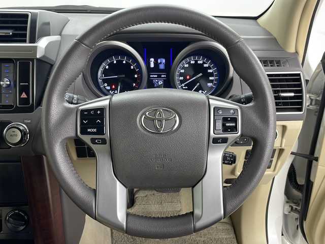 トヨタ ランドクルーザー プラド TX Lパッケージ 道央・札幌 2015(平27)年 8万km ホワイトパールクリスタルシャイン ・4WD/・社外ナビ(TV＆BT＆DVD＆CD)/・社外後席フリップダウンモニター/・バックカメラ/・レザーシート/・パワーシート/・シートヒーター/・クルーズコントロール/・横滑り防止/・純正ビルトインETC/・ドアミラーウィンカー/・オートライト/・フォグランプ