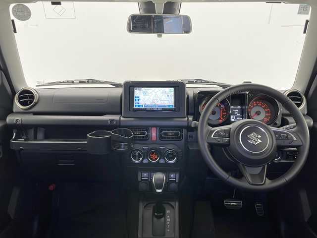 スズキ ジムニー シエラ JC 長野県 2024(令6)年 0.5万km ブルーイッシュブラックパール3 4WD/社外メモリナビ&フルセグTV&CD&DVD&BT/クルーズコントロール/車線逸脱警報/衝突軽減ブレーキ/後方コーナーセンサー/アイドリングストップ/前席シートヒーター/ステアリングスイッチ/ビルトインETC/LEDヘッドライト/オートライト/オートマチックハイビーム/フロントフォグランプ/電動格納ミラー/ウィンカーミラー/ドアミラーヒーター/純正15インチAW装着/社外フロアマット/社外ルーフキャリア/背面タイヤ/プッシュスタート/スマートキー