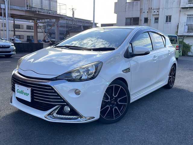 トヨタ アクア G G’s 宮崎県 2014(平26)年 9.2万km ライムホワイトパールクリスタルシャイン 純正ＳＤナビ(NSZT-W62G)/(BT/DTV/CD/DVD/AM/FM)/バックカメラ　/オートライト　/純正ＥＴＣ　/純正アルミホイール　/純正フロアマット　/電動格納ミラー　/ハーフレザーシート　/プッシュボタン　/スマートキー