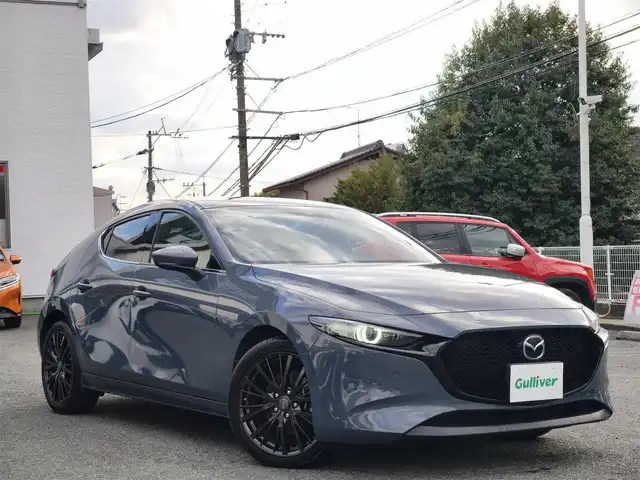 マツダ マツダ３ファストバック XD プロアクティブ ツーリングS 熊本県 2019(令1)年 9.8万km ポリメタルグレーM 純正ナビ/【フルセグTV/Bluetooth/CD/DVD】/バックカメラ/レーダークルーズコントロール/スマートブレーキサポート/ドライバーアテンションアラート/車線逸脱警報システム/レーンキープアシストシステム/ディスタンス＆スピードアラート/ブラインドスポットモニタリング/コーナーセンサー/ロードサインアシスト/ブレーキホールド/D席パワーシート/前席シートヒーター/オートLEDライト/オートハイビーム/社外18インチAW/革巻きステアリング/ステアリングスイッチ/ステアリングヒーター/ウィンカーミラー/アイドリングストップ/純正フロアマット/横滑り防止装置/保証書/取扱説明書/スペアキー