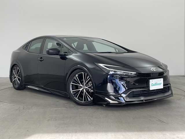 トヨタ プリウス Z 兵庫県 2023(令5)年 1.6万km アティチュードブラックマイカ ・純正ナビ（TV/USB/BT/MiraCast)/・パノラミックビューモニター/・ビルトインETC2.0/・モデリスタエアロ/・社外車高調/・トヨタセーフティセンス/・トヨタチームメイト/・アドバンスドパーク/・レーンディパーチャーアラート/・ブラインドスポットモニター/・プリクラッシュセーフティ/・プロアクティブドライビングアシスト/・後方車両接近告知/・パーキングサポートブレーキ/・安心降車アシスト/・周辺車両接近サポート/・ロードサインアシスト/・レーダークルーズコントロール/・レーンチェンジアシスト/・フロントクロストラフィックアラート/・オートマチックハイビーム/・クリアランスソナー/・パワーバックドア/・ワイヤレス充電/・レザーシート/・前席パワーシート/・前席シートヒーター/・前席エアシート/・ステアリングヒーター/・ドアミラーヒーター/・nanoeX/・AC１００V電源