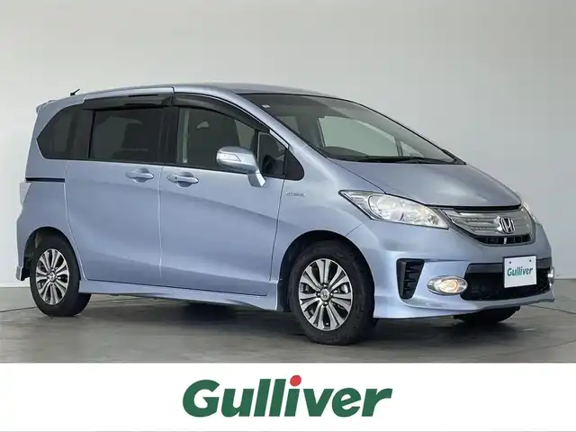 ホンダ フリード ハイブリット ジャストセレクション 埼玉県 2011(平23)年 6.7万km プレミアムブルーオパールメタリック 社外ナビ　バックカメラ　両側パワースライドドア　クルーズコントロール　ＥＴＣ　オートライト　キセノンヘッドライト　ハーフレザーシート　スマートキー　純正１５インチアルミホイール　純正フロアマット