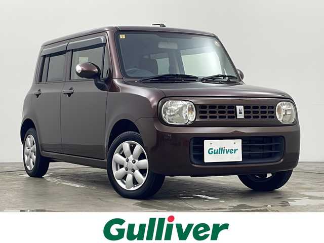 スズキ ラパン X 秋田県 2013(平25)年 6万km マルーンブラウンパール 4WD/ABS/盗難防止装置/D席シートヒーター/電動格納ミラー/ウィンカーミラー/純正オーディオ/ヘッドライトレベライザー/純正アルミホイール/純正フロアマット/サイドバイザー