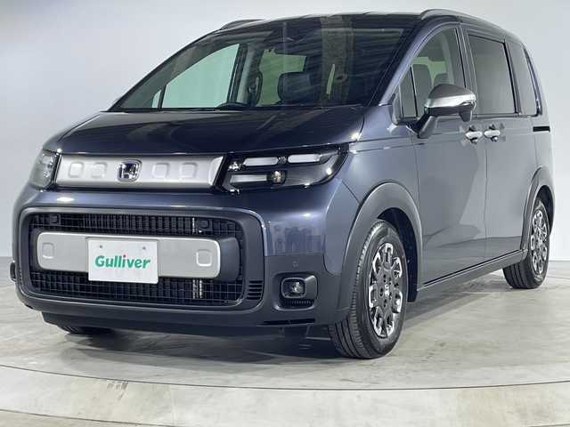 ホンダ フリード ハイブリット e:HEV クロスター 福岡県 2025(令7)年 0.1千km メテオロイドグレーメタリック 禁煙車/純正9インチナビ（LXM-242ZFNI）/フルセグテレビ/バックカメラ/レーダークルーズコントロール/LEDヘッドライト/シートヒーター/純正15インチアルミホイール/両側パワースライドドア/スマートキー/プッシュスタートエンジン/革巻きステアリング/ブラインドスポットモニター