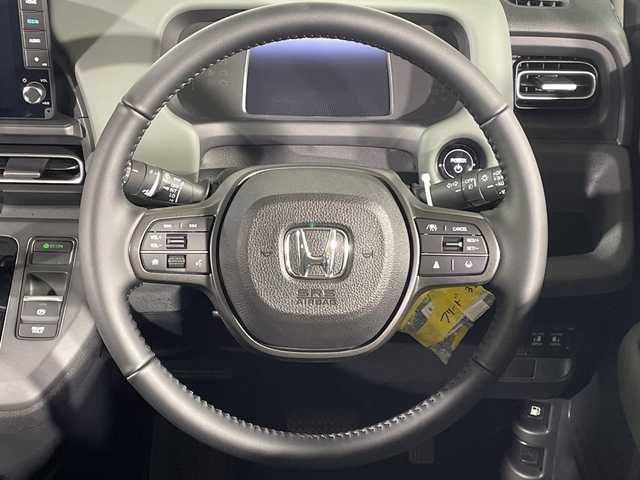 ホンダ フリード ハイブリット e:HEV クロスター 福岡県 2025(令7)年 0.1千km メテオロイドグレーメタリック 禁煙車/純正9インチナビ（LXM-242ZFNI）/フルセグテレビ/バックカメラ/レーダークルーズコントロール/LEDヘッドライト/シートヒーター/純正15インチアルミホイール/両側パワースライドドア/スマートキー/プッシュスタートエンジン/革巻きステアリング/ブラインドスポットモニター