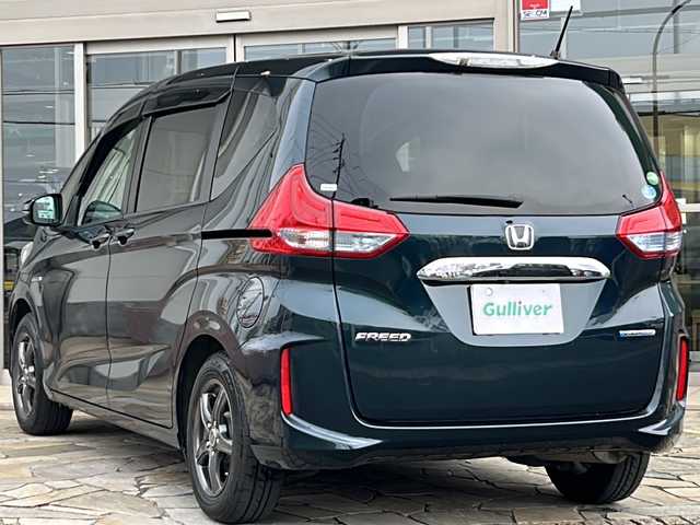 ホンダ フリード ハイブリット G ホンダセンシング 静岡県 2019(平31)年 6.8万km フォレストグリーンパール 純正ナビ/（Bluetooth／CD／DVD／フルセグTV）/バックカメラ/ビルトインＥＴＣ/レーダークルーズコントロール/両側パワースライドドア/衝突被害軽減システム/レーンキープ/ＬＥＤヘッドライト/オートライト/盗難防止装置/横滑り防止装置/3列シート/プッシュスタート/スマートキー