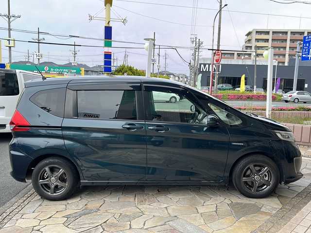 ホンダ フリード ハイブリット G ホンダセンシング 静岡県 2019(平31)年 6.8万km フォレストグリーンパール 純正ナビ/（Bluetooth／CD／DVD／フルセグTV）/バックカメラ/ビルトインＥＴＣ/レーダークルーズコントロール/両側パワースライドドア/衝突被害軽減システム/レーンキープ/ＬＥＤヘッドライト/オートライト/盗難防止装置/横滑り防止装置/3列シート/プッシュスタート/スマートキー